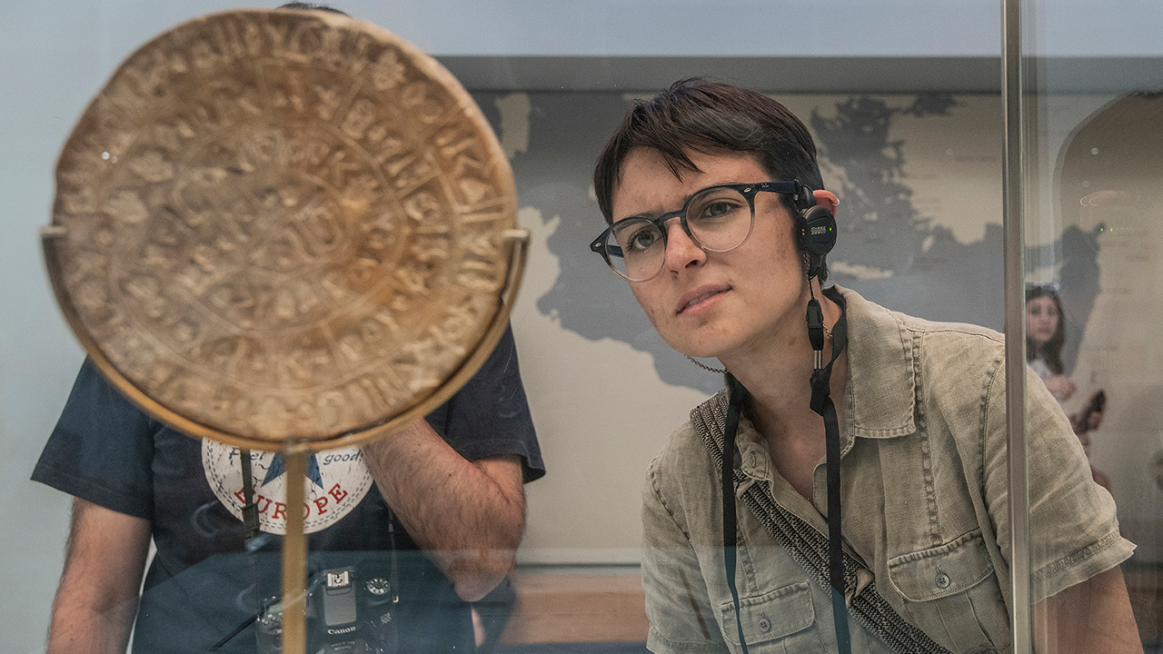 Person looking at an artifact in a museum