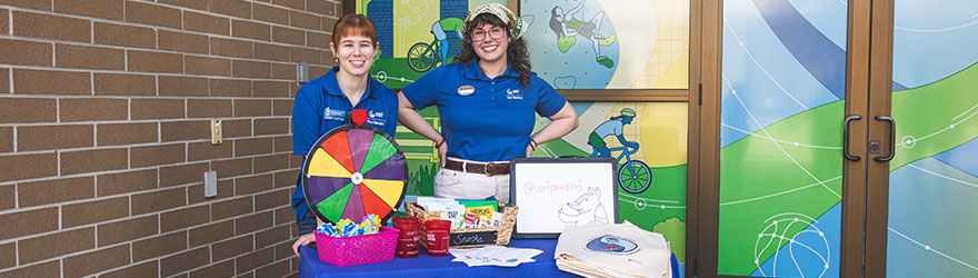 Peer Educators tabling with giveaways
