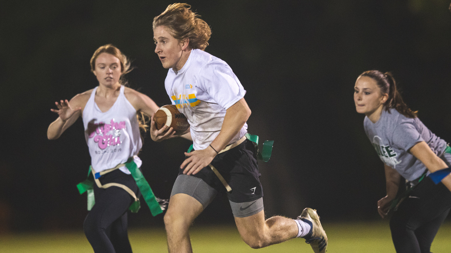 Students playing flag football.