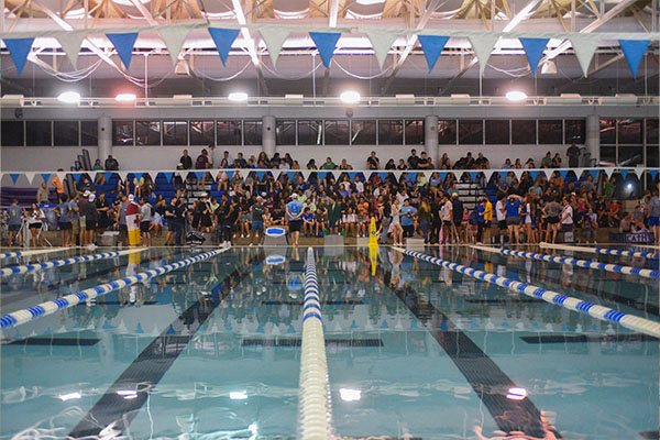 group of students gathered in aquatic center