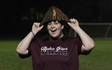 Participant with softball glove on head