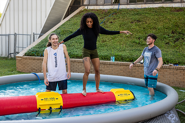 Student Using Log Rolling equipment at event