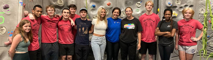 oa family posing in front of rock wall