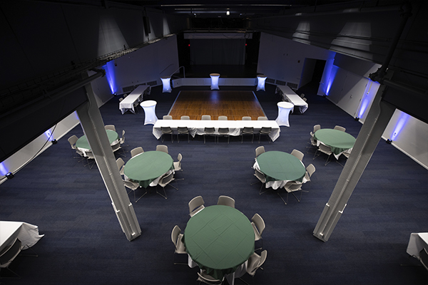 Commons Auditorium set up with round tables