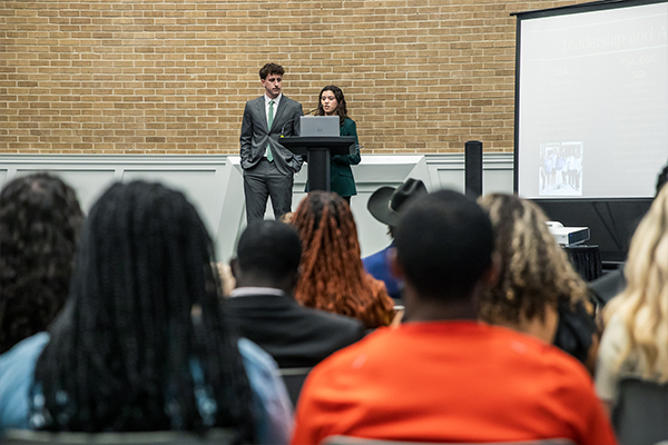 Students speaking at an open forum during SGA election