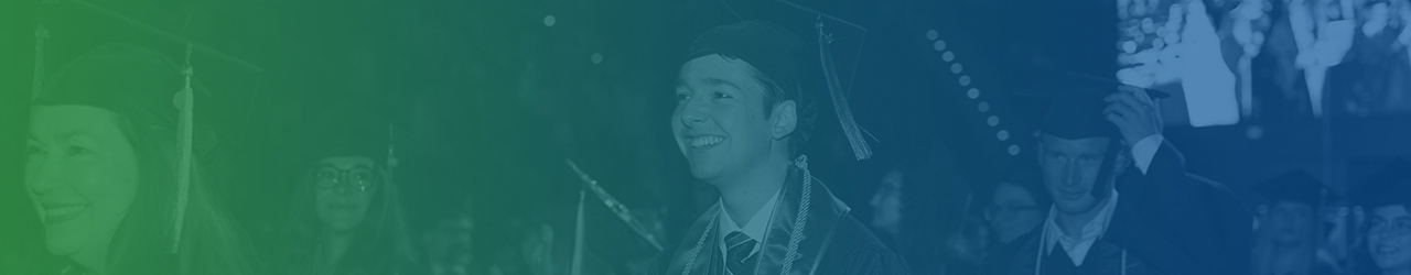 UWF graduates walk back to their seats after crossing the stage at Commencement.