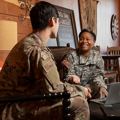 two military students studying in the Emerald Coast location coffee shop
