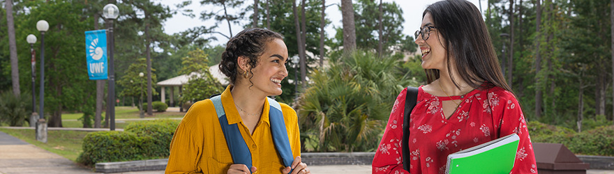 Students chat between classes at UWF Emerald Coast.