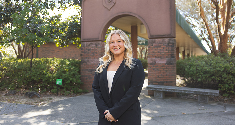 Recruiter Emma Hall standing in front of the Cantor Al Sol.