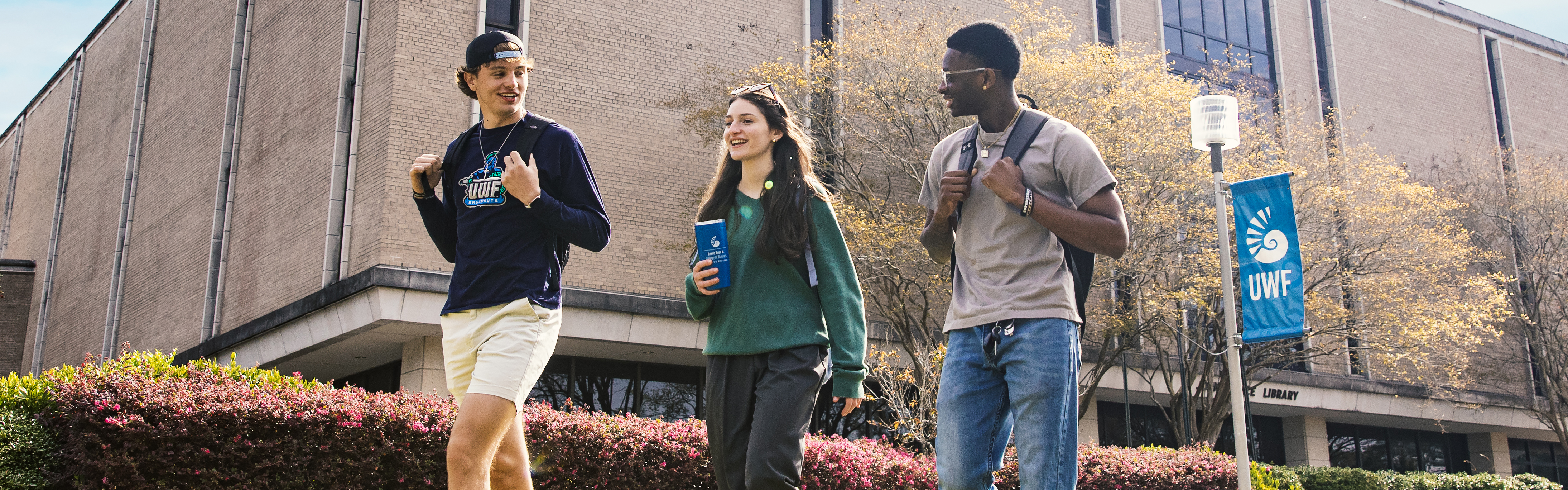 Students walk in front of Pace Library
