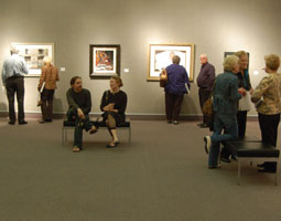 Small crowd of people in an art gallery.