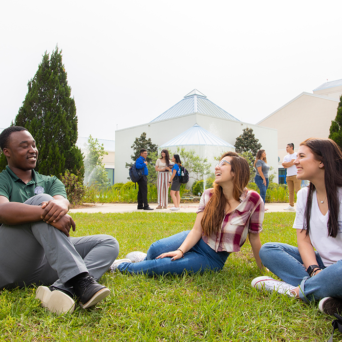 Students relaxing near the fountain at the CFPA