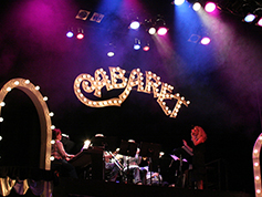 The set of UWF Theatres production of Cabaret featuring a light up sign