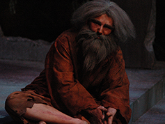 A student performing in UWF Theatres production of Rashomon
