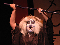 A student performing in UWF Theatres production of Rashomon