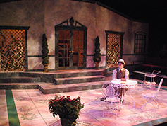 A student performing in UWF Theatres production of The Importance of Being Earnest