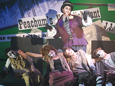 Students performing in UWF Theatres production of The Threepenny Opera