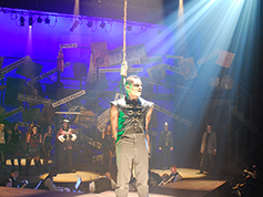 A student performing in UWF Theatres production of The Threepenny Opera