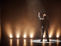 A student performing in UWF Theatres production of Evita