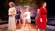 Lizzie and the ensemble musical number