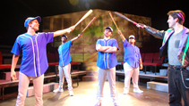 Nick, Danny and Alan with male ensemble in softball uniforms