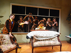 The ensemble appears at the window
