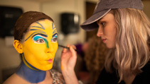 Students applying makeup for UWF Theatres production of The Little Mermaid