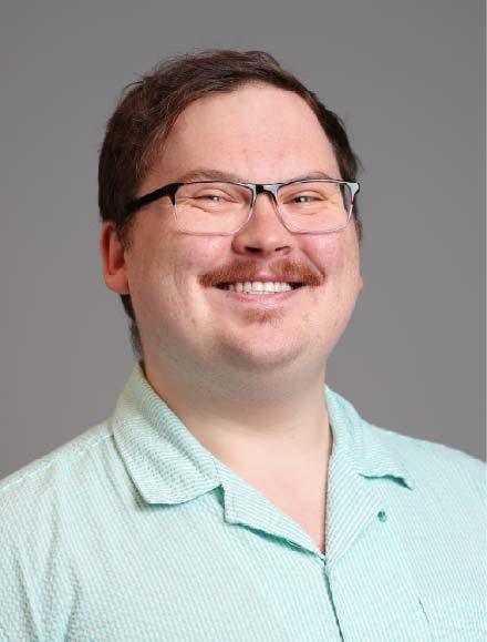 Dr. Robert Martin in a pale green polo shirt.