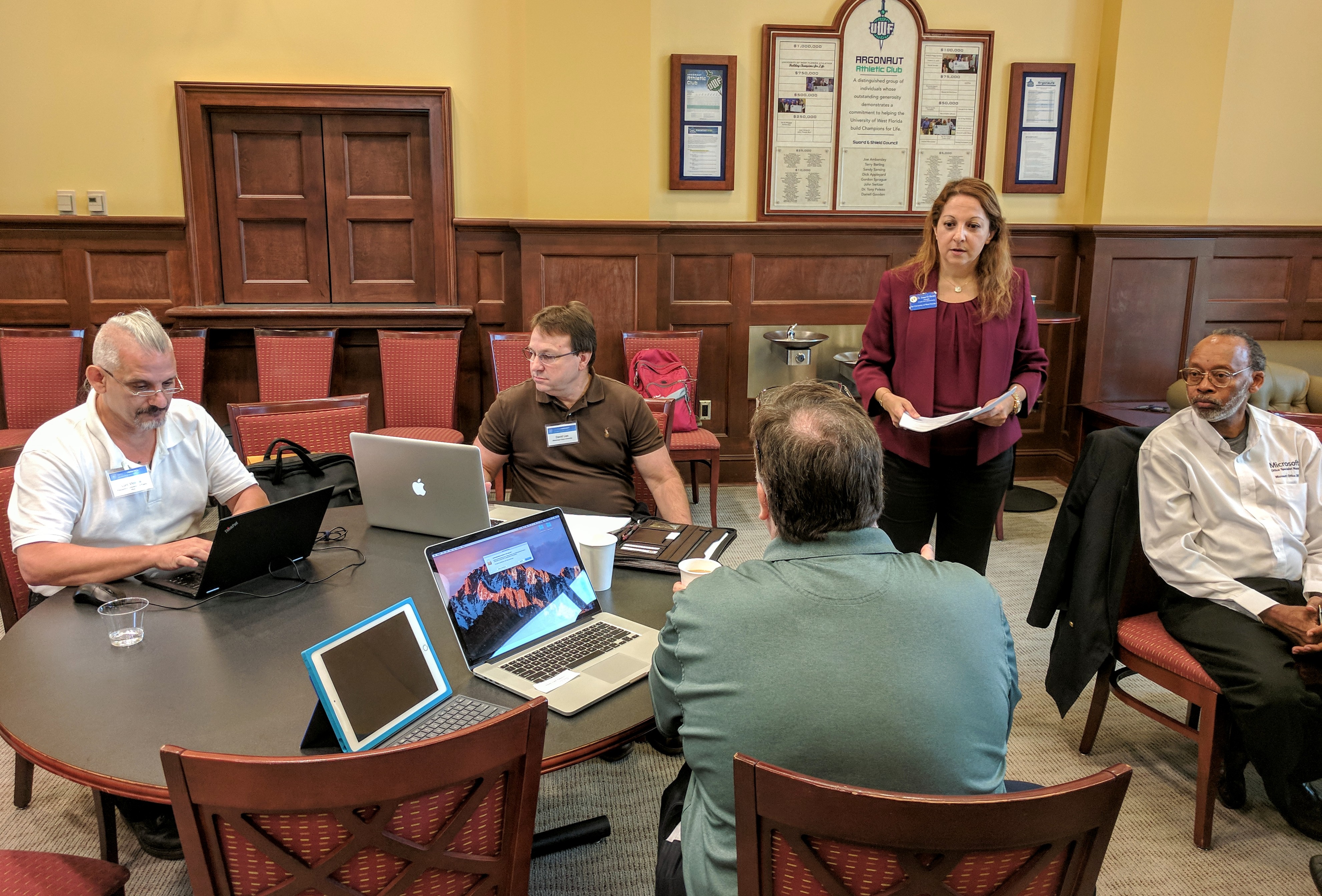 Eman El-Sheikh, UWF Center for Cybersecurity director, explains steps for institutions to take to earn Center of Academic Excellence designation from National Security Agency and Department of Homeland Security on Sept. 27 at Argo Alumni Club.