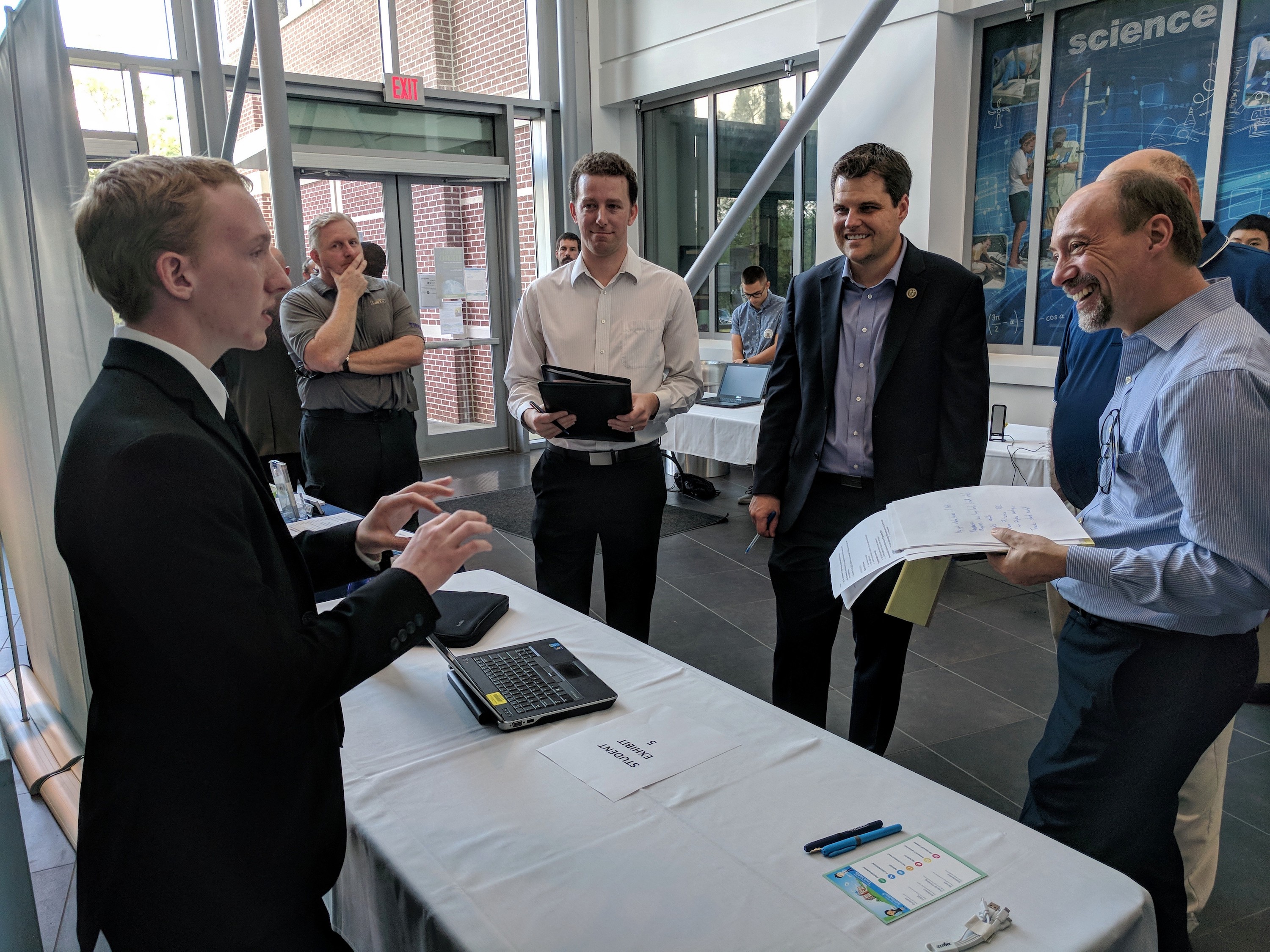 Tate High School senior John Chamblee answers questions from Congressman Matt Gaetz and other judges about his app at the Congressional App Challenge on Nov. 18 in Building 4 of the UWF campus.