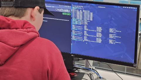 Student sitting at computer.