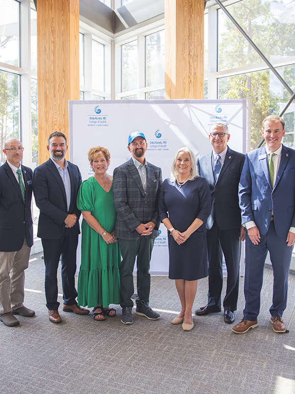 Group photo from left to right David Bellar, Jaromy Kuhl, Mona Wright, Stephen Wright, Martha Saunders, Mark Diana, and Howard Reddy at the Wright Family Institute naming ceremony.