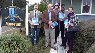 presenters standing outside the Walton County Heritage Museum
