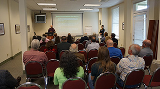 participants listening watching a presentation