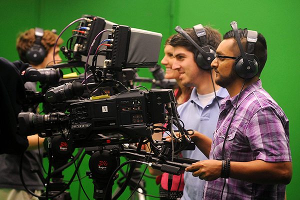 Students working with tv production equipment