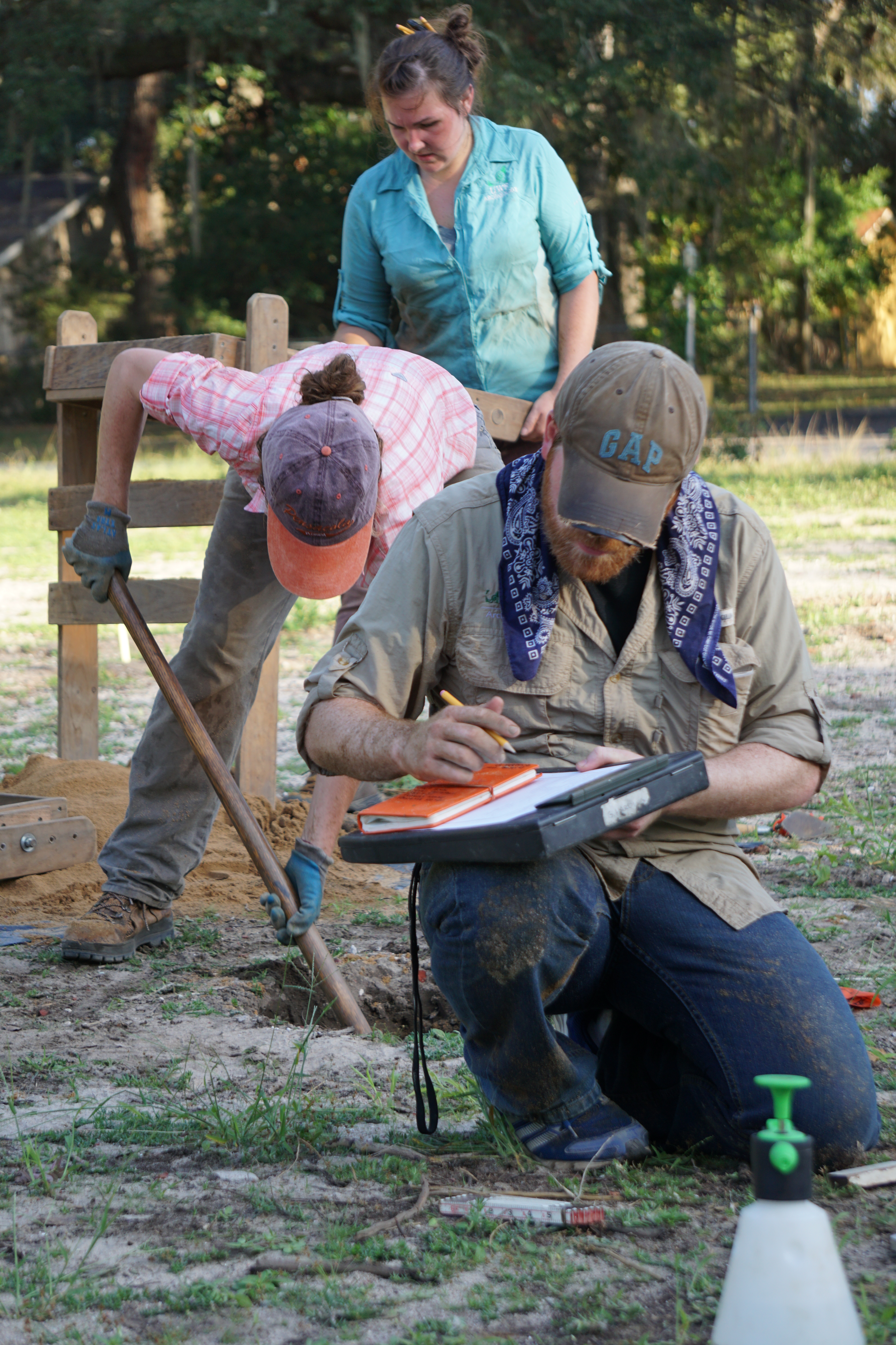 Students with the University of West Florida Excavating and documenting a shovel test at the Luna Settlement site