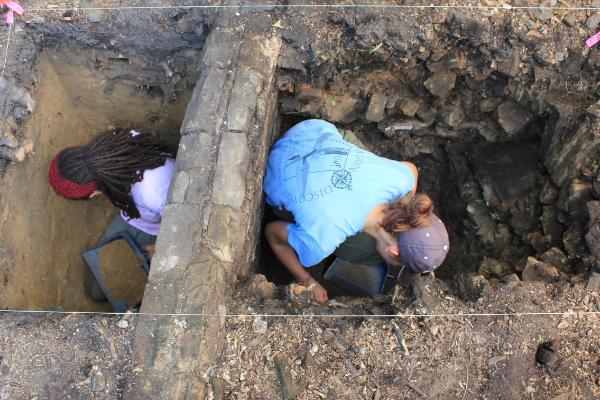 Archaeology students excavate a unit at the Arcadia Mill Homestead site