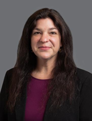 A woman wearing a black jacket.