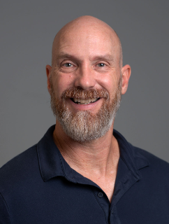 Man smiling faculty photograph