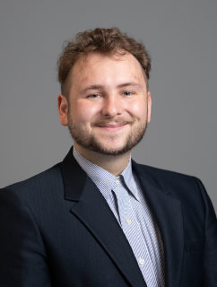 Faculty headshot of Grover Ballard wearing a suit