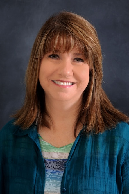 A staff member in a floral top.