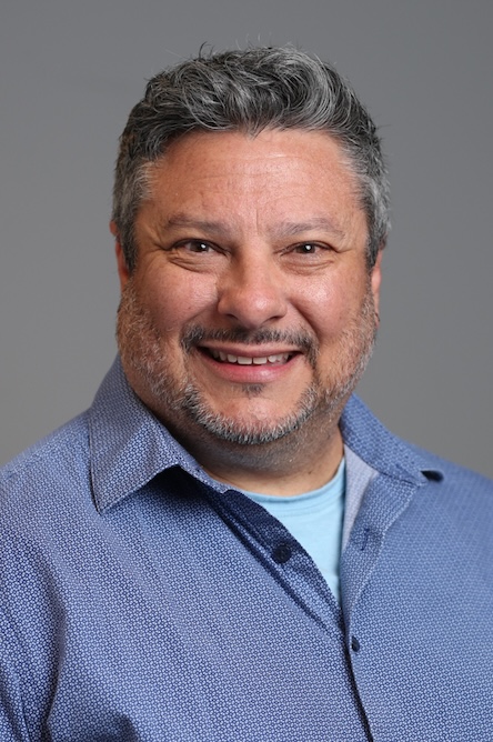 A staff member smiling for a headshot.