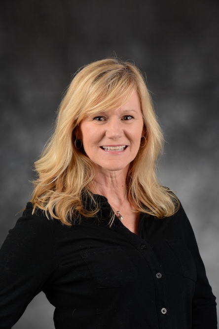 A headshot of a faculty member and graduate program advisor.