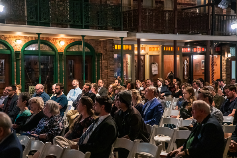 A crowd listening to a lecture at the Downtown Pensacola Museum of Commerce