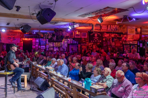 A musician plays to a crowd