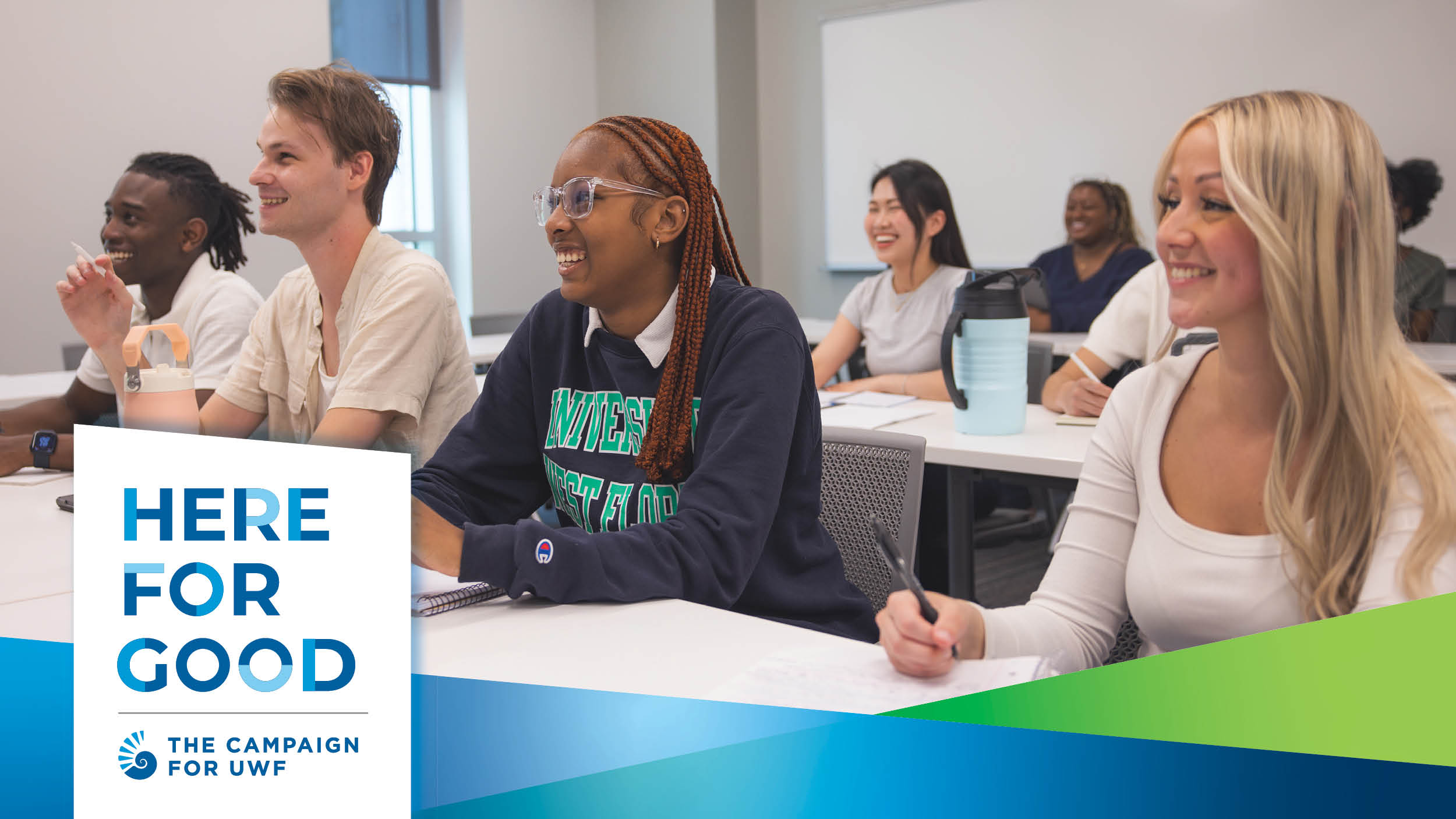 Students sitting at tables in a classroom.