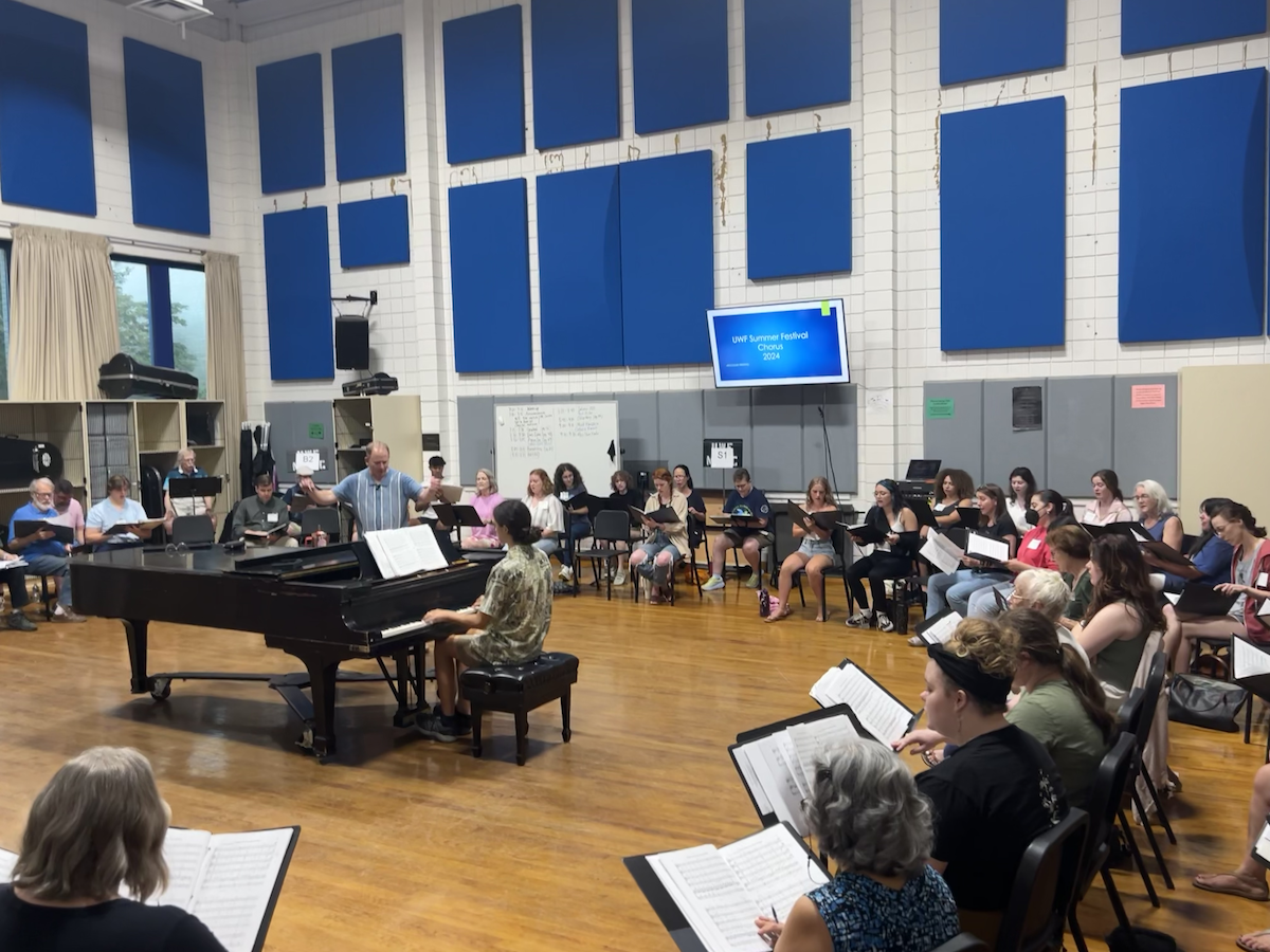 A large classroom full of adults singing.