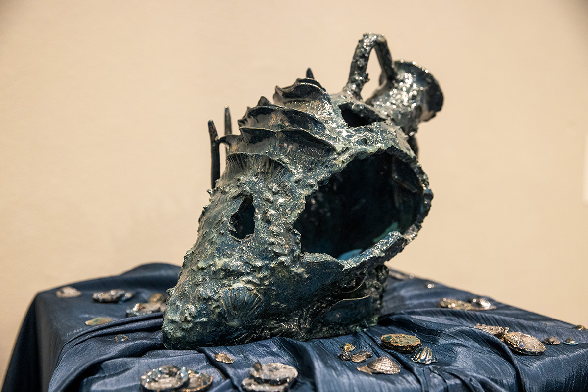 A ceramic reproduction of sunken objects from a shipwreck.