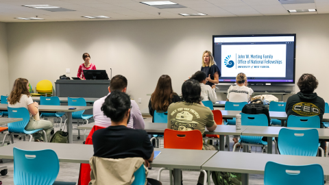 Students listening to information about fellowship opportunities.
