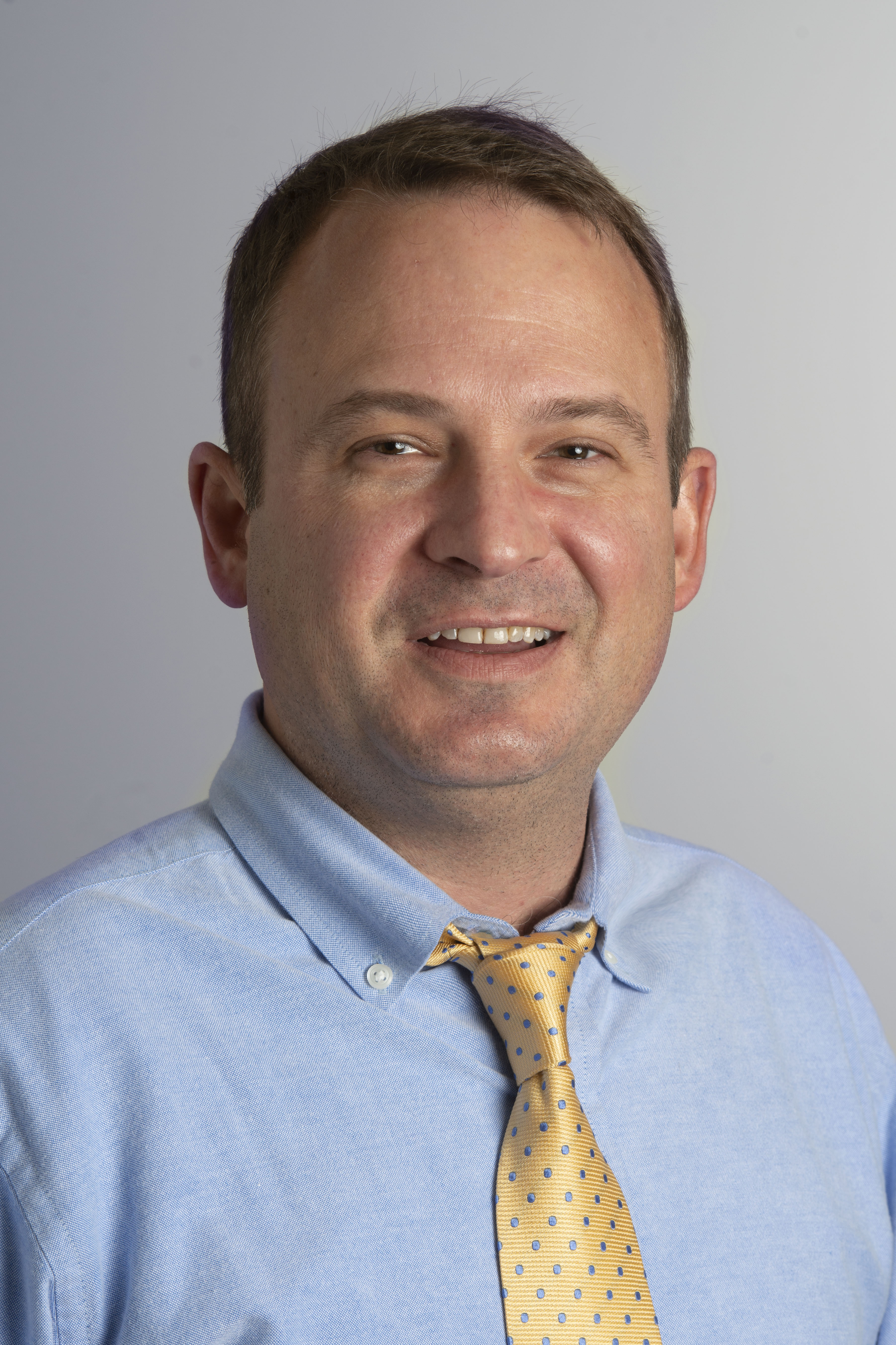 Eric Schade indoor headshot.